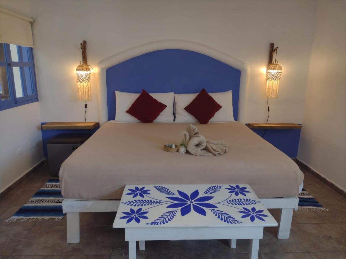Mio Tulum Hotel Boutique المظهر الخارجي الصورة A bedroom in a hotel in Santorini, Greece